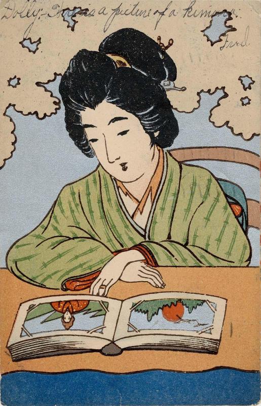 Woman Viewing Postcards in an Album