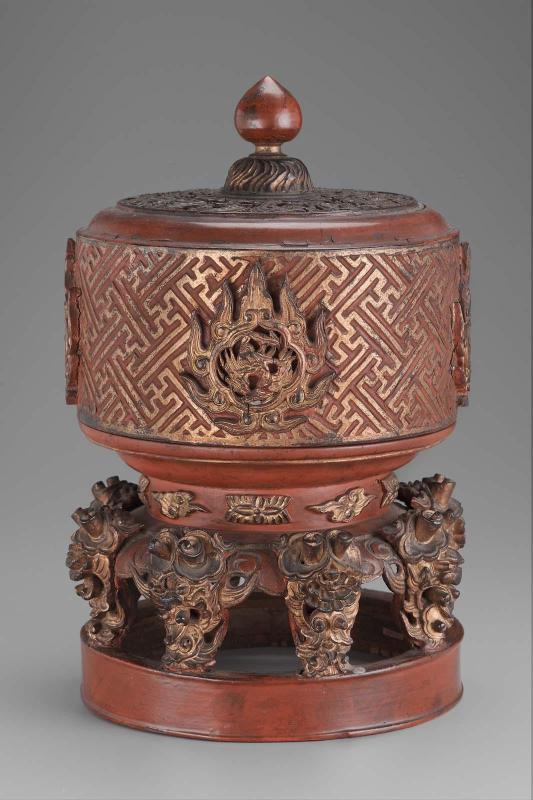 Lacquered and carved wooden container with cover on high foot
