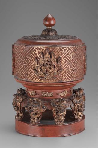 Lacquered and carved wooden container with cover on high foot