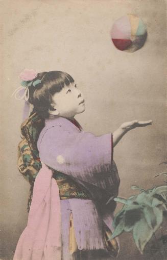 Girl Playing with Paper Balloon