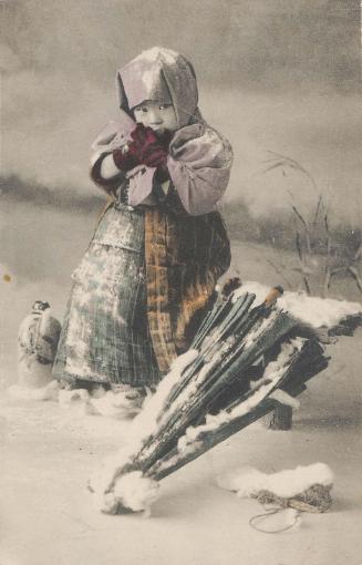 Child in Winter Clothes Dusted with Snow