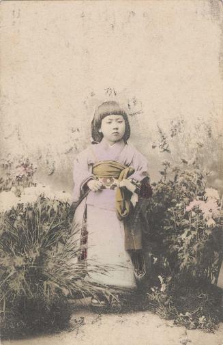 Girl Standing in Garden