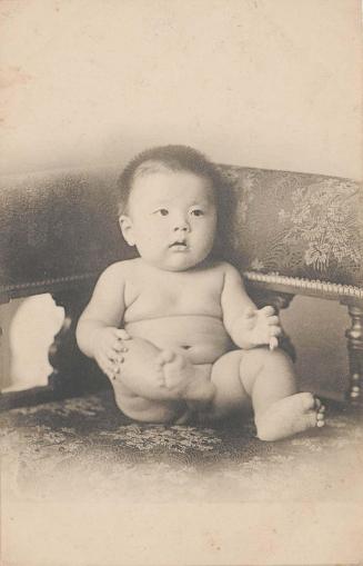 Naked Baby Sitting on Chair
