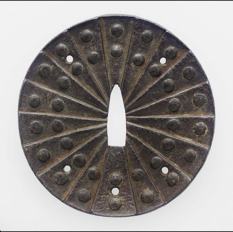 Tsuba formed from eighteen overlapping riveted plates