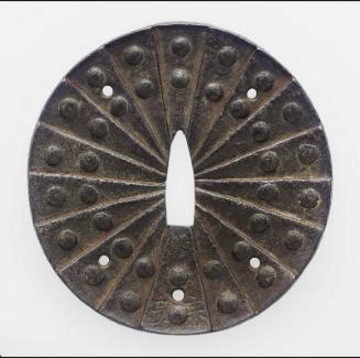 Tsuba formed from eighteen overlapping riveted plates