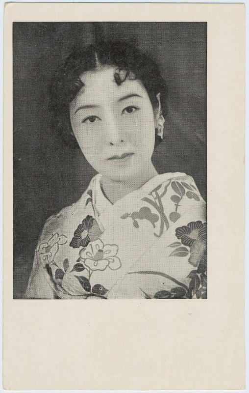 Woman with curls wearing kimono