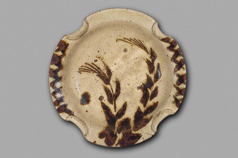 Dish with design of grasses