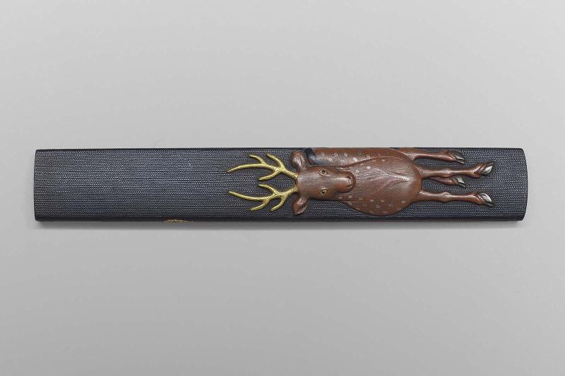 Kozuka with design of stag and bamboo staff