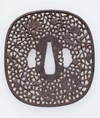 Tsuba with design of lotus and other floral scrolls