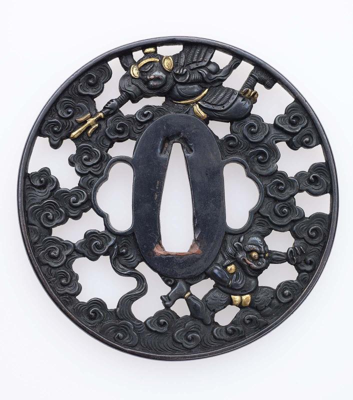 Tsuba with design of Idaten chasing an oni through clouds