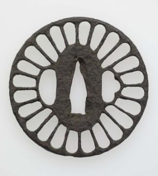 Tsuba in the form of a stylized chrysanthemum