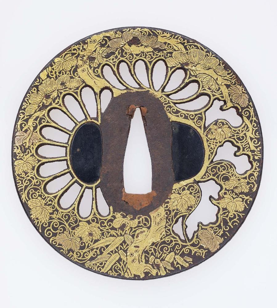 Tsuba with design of chrysanthemum, pine and bamboo grass