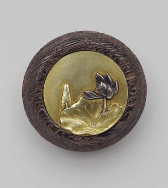 Kagami netsuke with design of a lotus flower and leaf