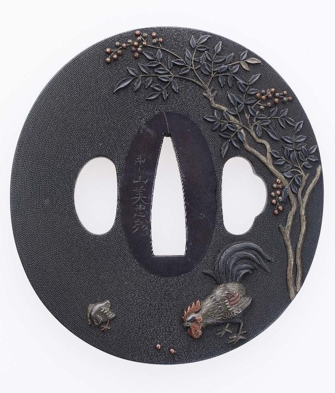 Tsuba with design of hen and chicks beneath a flowering shrub