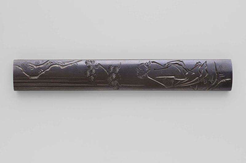 Kozuka with design of Chinese poet Rihaku (Li Bai) looking at a waterfall