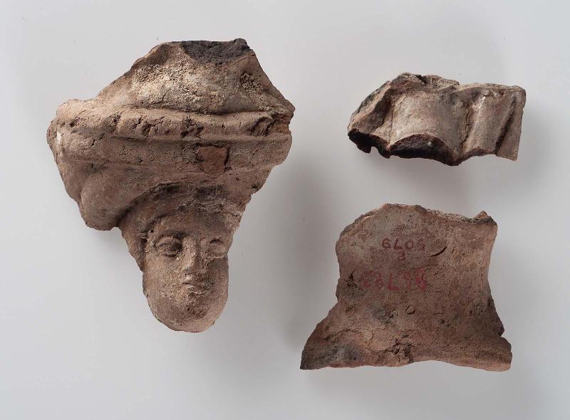 Three fragments of a female figure