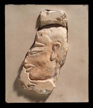 Relief of fragmentary head of man