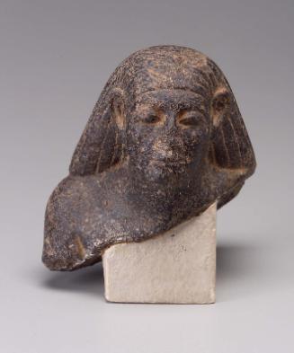 Fragment of a male statuette
