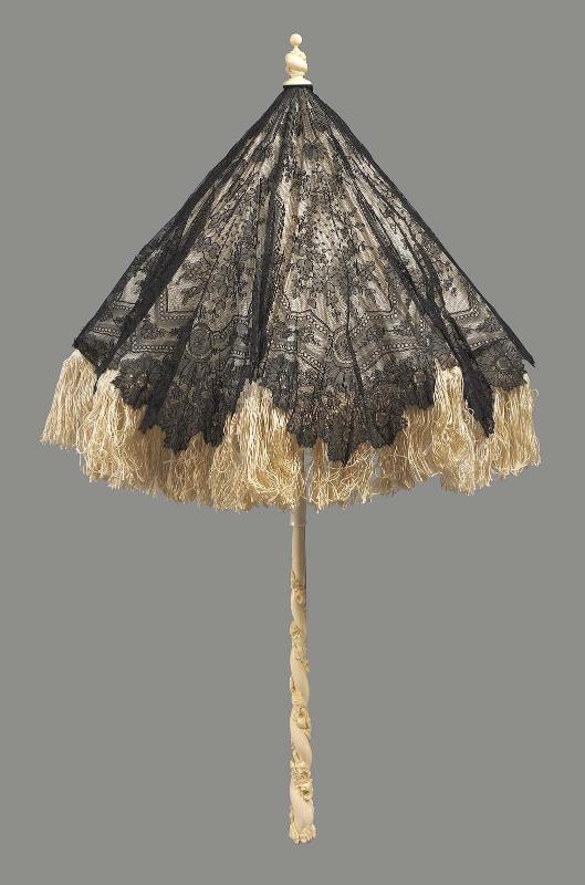 A small parasol of black bobbin lace