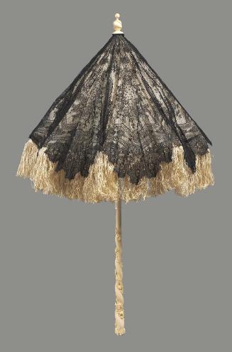 A small parasol of black bobbin lace