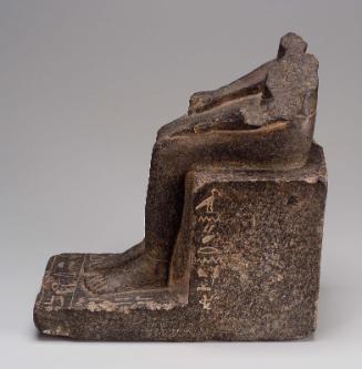 Lower portion of seated figure