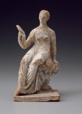 Figurine of a girl with a mirror