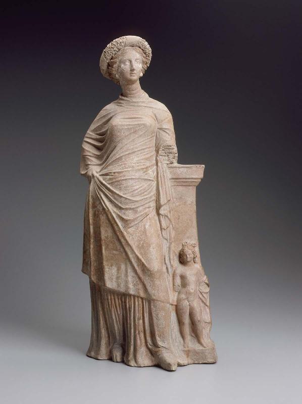 Statuette of a woman leaning on a pillar