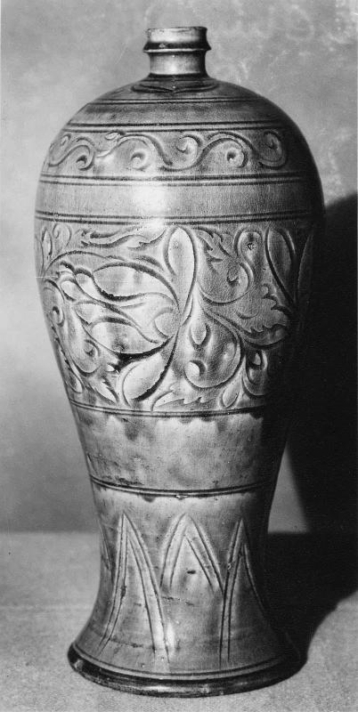 Meiping-shaped vase decorated with celadon glaze over carved floral design