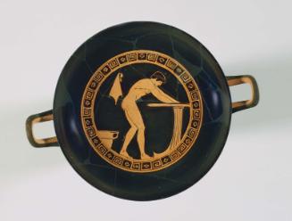 Drinking cup (kylix) with a nude youth washing at a basin