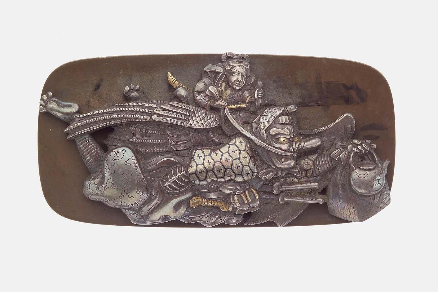 Kanamono in the form of Ushiwakamaru (Yoshitsune) riding on the back of Sojobo, King of the Tengu, with a backplate with a design of tengu at kendo practice