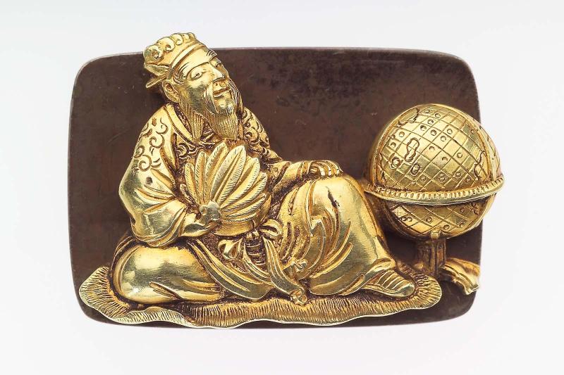 Kanamono in the form of a seated Chinese scholar with a globe, with backplate