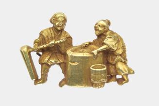Kanamono in the form of two peasants pounding rice