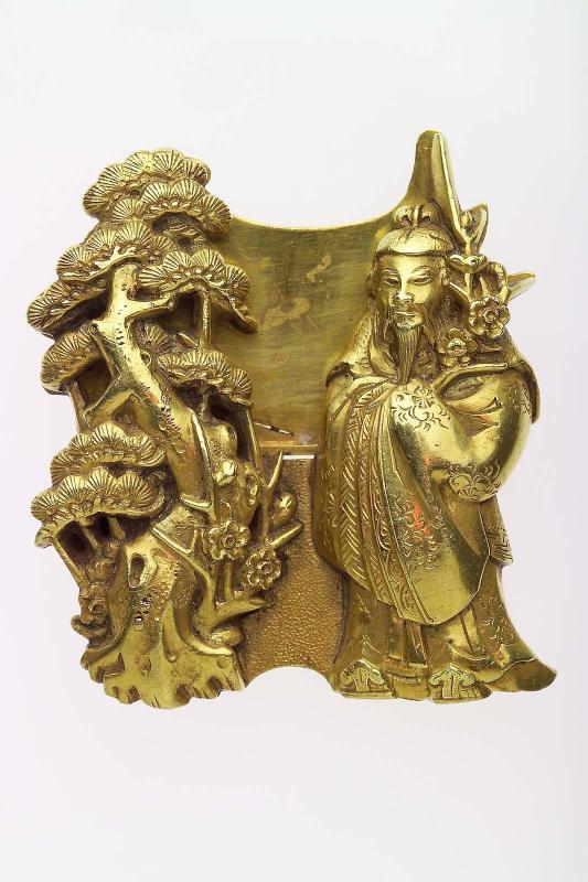 Kanamono in the form of Sugawara no Michizane holding a branch of plum, and a pine tree, with backplate