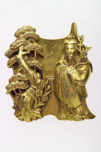 Kanamono in the form of Sugawara no Michizane holding a branch of plum, and a pine tree, with backplate