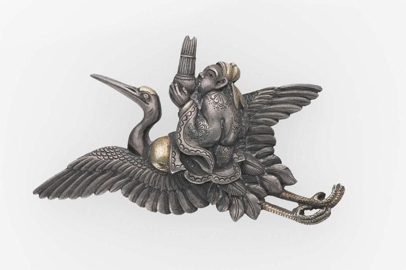 Kanamono in the form of Shoshi on a crane playing the sho-pipes