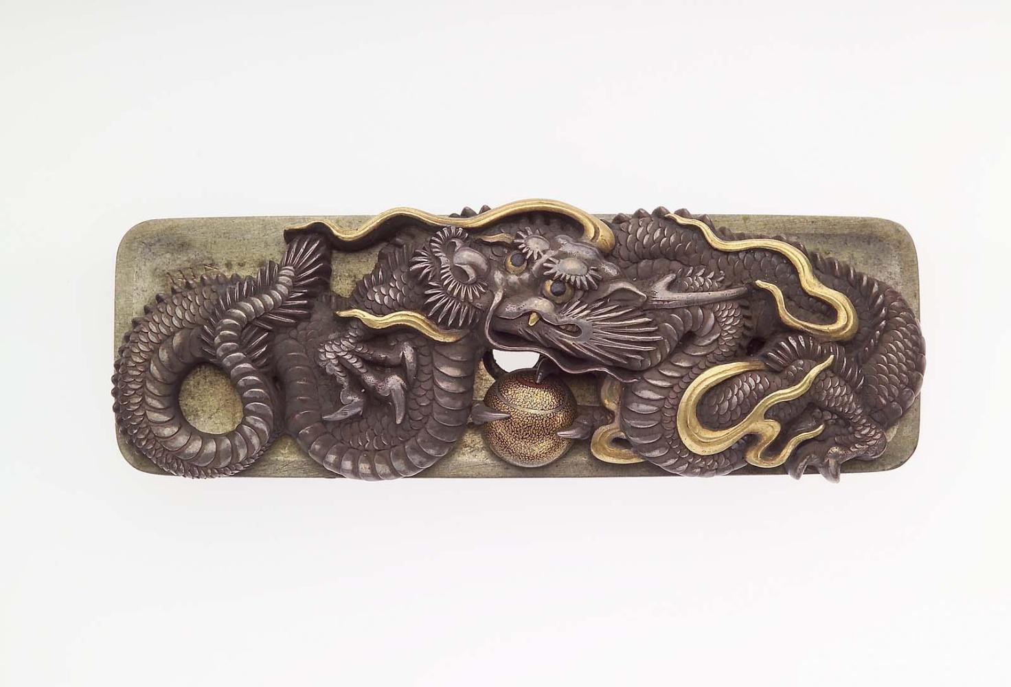 Kanamono in the form of a dragon and jewel, with backplate engraved with waves