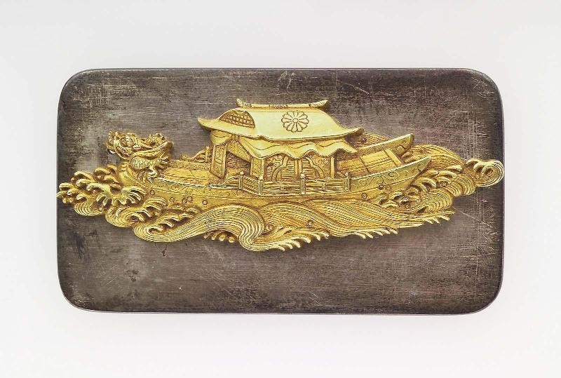 Kanamono in the form of a dragon ship and waves