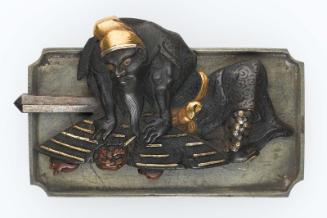 Kanamono in the form of Shoki trapping an oni under a hat, with backplate engraved with a fleeing oni