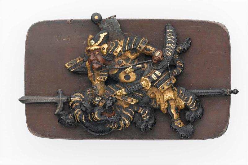 Kanamono in the form of Hadesu suppressing a Korean tiger,  with backplate engraved with bamboo