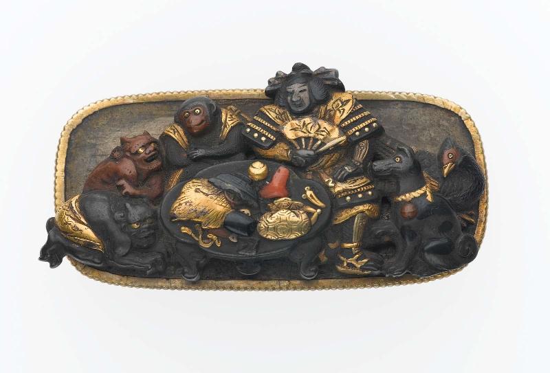 Kanamono in the form of Momotaro feasting with his animal friends and oni captives, with backplate