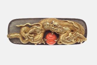 Kanamono in the form of a dragon and jewel, with backplate engraved with waves