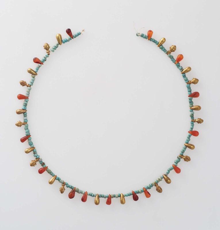 Necklace with beads and small pendants