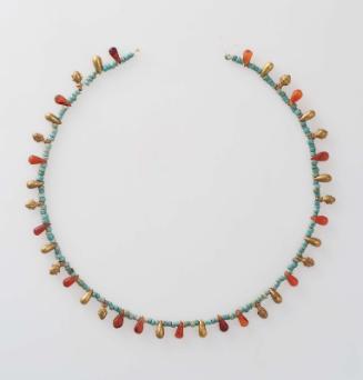 Necklace with beads and small pendants
