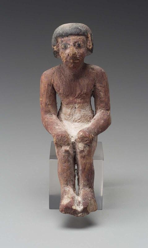 Seated male figure