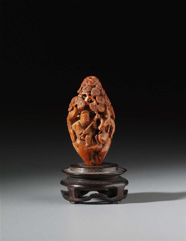 Carved peach pit