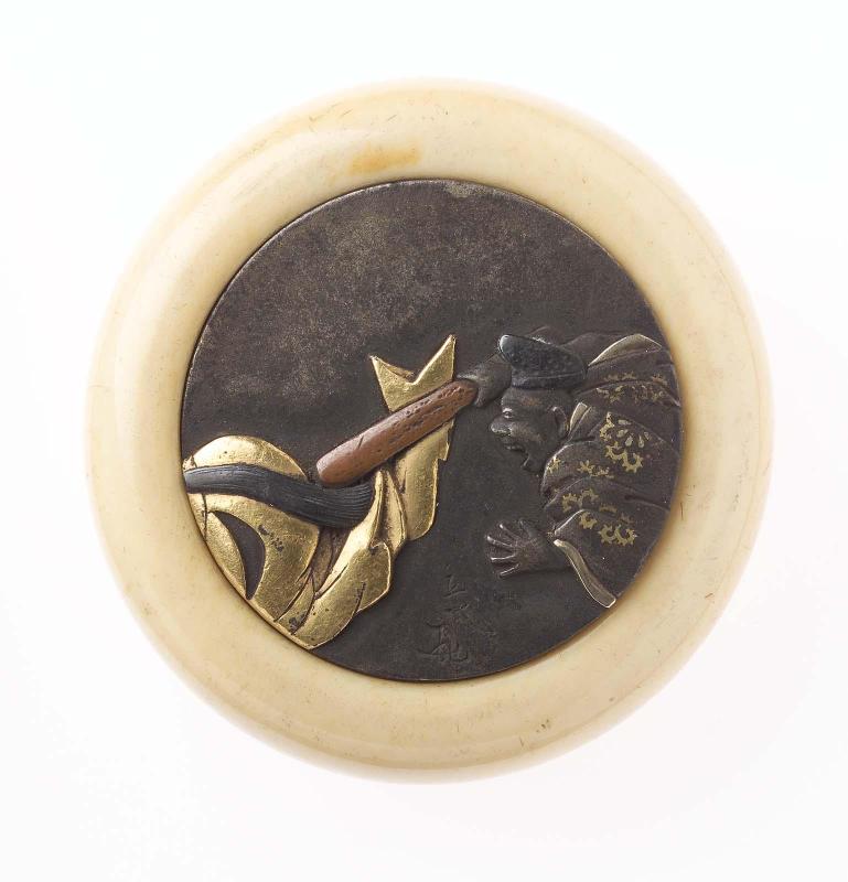 Kagami netsuke with design of man and woman