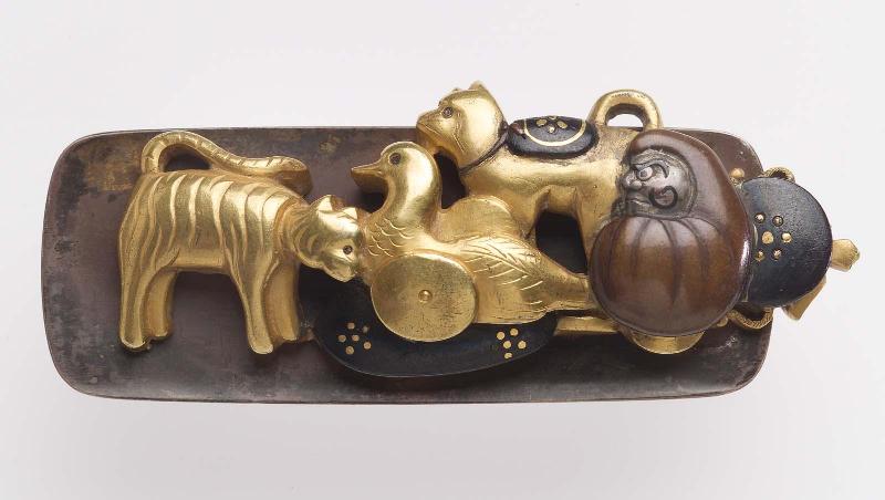 Kanamono in the form of a group of toys, with backplate