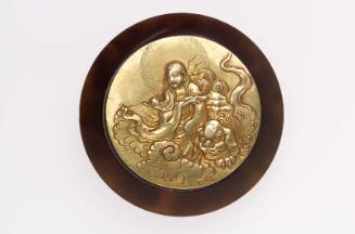 Kagami netsuke with design of Monju Bosatsu and lion on clouds