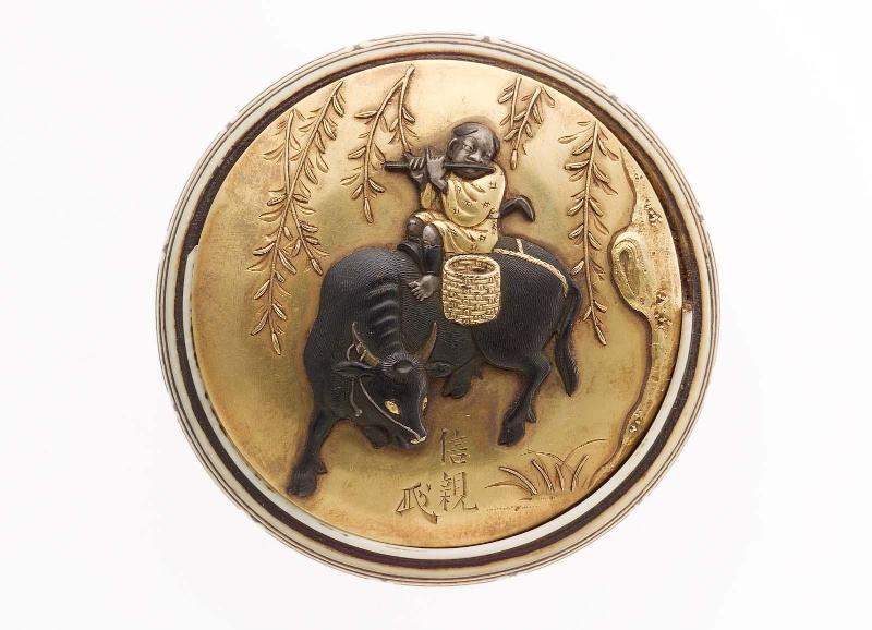 Kagami netsuke with design of herdboy on an ox, with willow tree