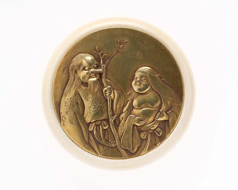 Kagami netsuke with design of Okame and a long-nosed tengu